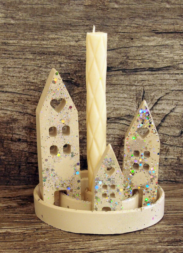 Decorative candle with small houses and glitter